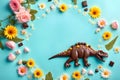 Dinosaure chocolate easter eggs and spring colored daisy flowers Royalty Free Stock Photo