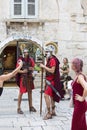 Diocletian Palace, tourists taking pictures of men in Roman legionnaire costumes, Split, Croatia