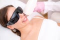 Diode laser hair removal, Beautician removes hair on beautiful female face, Hair removal for smooth skin, laser