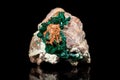 Dioptase mineral stone, bedrock, black background, healing gemstone