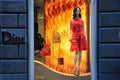 Dior luxury fashion store in Italy with amazing red dress and purses for women Royalty Free Stock Photo