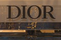 Dior, illuminated jewelry and high couture brand name on Champs Elysees avenue in Paris