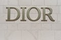 TIVAT, MONTENEGRO - JULY 15, 2021: Dior signboard on the wall of a branded boutique