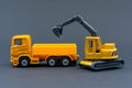 Diorama road construction with yellow construction machinery models