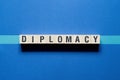 Diplomacy word concept on cubes