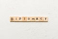 diplomacy word written on wood block. diplomacy text on cement table for your desing, concept