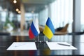 Diplomatic solution shows flags of Russia and Ukraine with documents on a table for a peace negotiation scenario Royalty Free Stock Photo