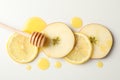 Dipper, honey, apple and lemon slices on white background