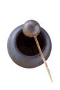 dipper or scoop coconutshell ladle on the clay jar on white isolated