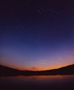 Dipper stars in the sky by the lake. Scenic landscape. Ursa majo