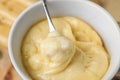 Dipping bread into delicious cheese fondue Royalty Free Stock Photo