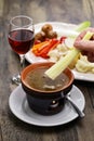 dipping celery. Bagna cauda(Italian Piedmont cuisine) is a hot dip made from garlic and anchovies.