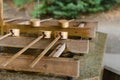 Dipping cups for cleansing ceremony, hand wash pavilion before enter the shrine gate at Meiji jingu in Tokyo, Japan. religion and Royalty Free Stock Photo