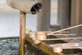 Dipping cups for cleansing ceremony, hand wash pavilion before enter the shrine gate at Meiji jingu in Tokyo, Japan. religion and Royalty Free Stock Photo