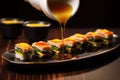 dipping sushi into a small dish of miso sauce Royalty Free Stock Photo