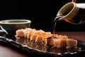 dipping sushi in soy sauce Royalty Free Stock Photo