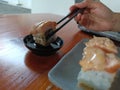 Dipping sushi in vinegar Royalty Free Stock Photo