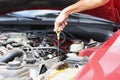 Dipstick for checking oil level in car engine closeup Royalty Free Stock Photo