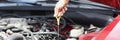 Dipstick for checking oil level in car engine closeup Royalty Free Stock Photo