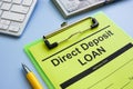 Direct deposit loan application form and pen.