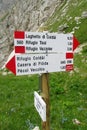 Direction indicator arrow on mountain pass in Dolomites Royalty Free Stock Photo