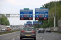 Direction sign in blue and white heading Breda and Rotterdam on motorway A13 and Europoort via A20 with speed limits