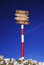 Trail markings with directions for the orientation of the tourists. Direction sign in Piatra Craiului Mountains.