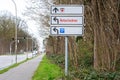 Direction sign shows Red Cross, parking symbol and German text Notaufnahme, meaning emergency department, at the road to a large Royalty Free Stock Photo