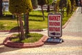 Direction sign to the souvenir shop. Crossroads of pedestrian paths Royalty Free Stock Photo