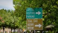 Direction sign to State Capitol Parking and Texas State History Museum - AUSTIN, UNITED STATES - OCTOBER 31, 2022 Royalty Free Stock Photo