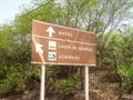 Direction signs for the City of Natal and the logo of Genipabu