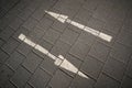 Directional arrows on a paved street Royalty Free Stock Photo