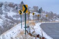 Directional road signs on mountain road in winter Royalty Free Stock Photo