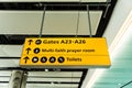 Directional sign at airport, yellow illuminated airport sign Royalty Free Stock Photo