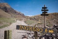 Directional sign with arrow pointing where is entrance on hiking trail in Aconcagua National Park, Andes Mountains, Argentina. Royalty Free Stock Photo