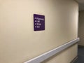 Directional sign on a clinic wall for pharmacy, lab, Xray and la