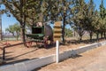 Directional sign and an ox-wagon in Matjiesfontein