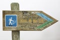 Directional signpost to the Pichincha Volcano on white background near Quito