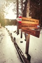 Directional wooden signs. Forest and snow. Royalty Free Stock Photo