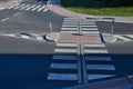 directionally divided lanes at intersection. crossing has a raised safety Royalty Free Stock Photo