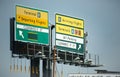 Airport Signs Showing Various Terminals At LaGuardia Airport, New York City