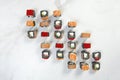 Directly above of Large set of black rice Japanese sushi roll pieces served on white marble background
