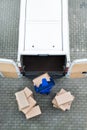 Delivery Man Unloading Cardboard Boxes From Van On Street Royalty Free Stock Photo