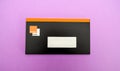 Directly above shot of envelope with Orange Bank check book - first online