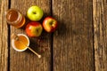 Directly above shot of honey in jar and bowl with dipper, apples and pomegranate seeds on table Royalty Free Stock Photo