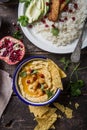 Directly above shot of Hummus or humus In bowl on table. Vegan plant based food