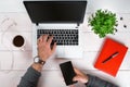 Directly above view of human hands typing on laptop. Royalty Free Stock Photo