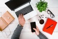 Directly above view of human hands typing on laptop. Royalty Free Stock Photo