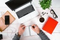 Directly above view of human hands typing on laptop. Royalty Free Stock Photo