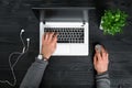 Directly above view of human hands typing on laptop. Royalty Free Stock Photo